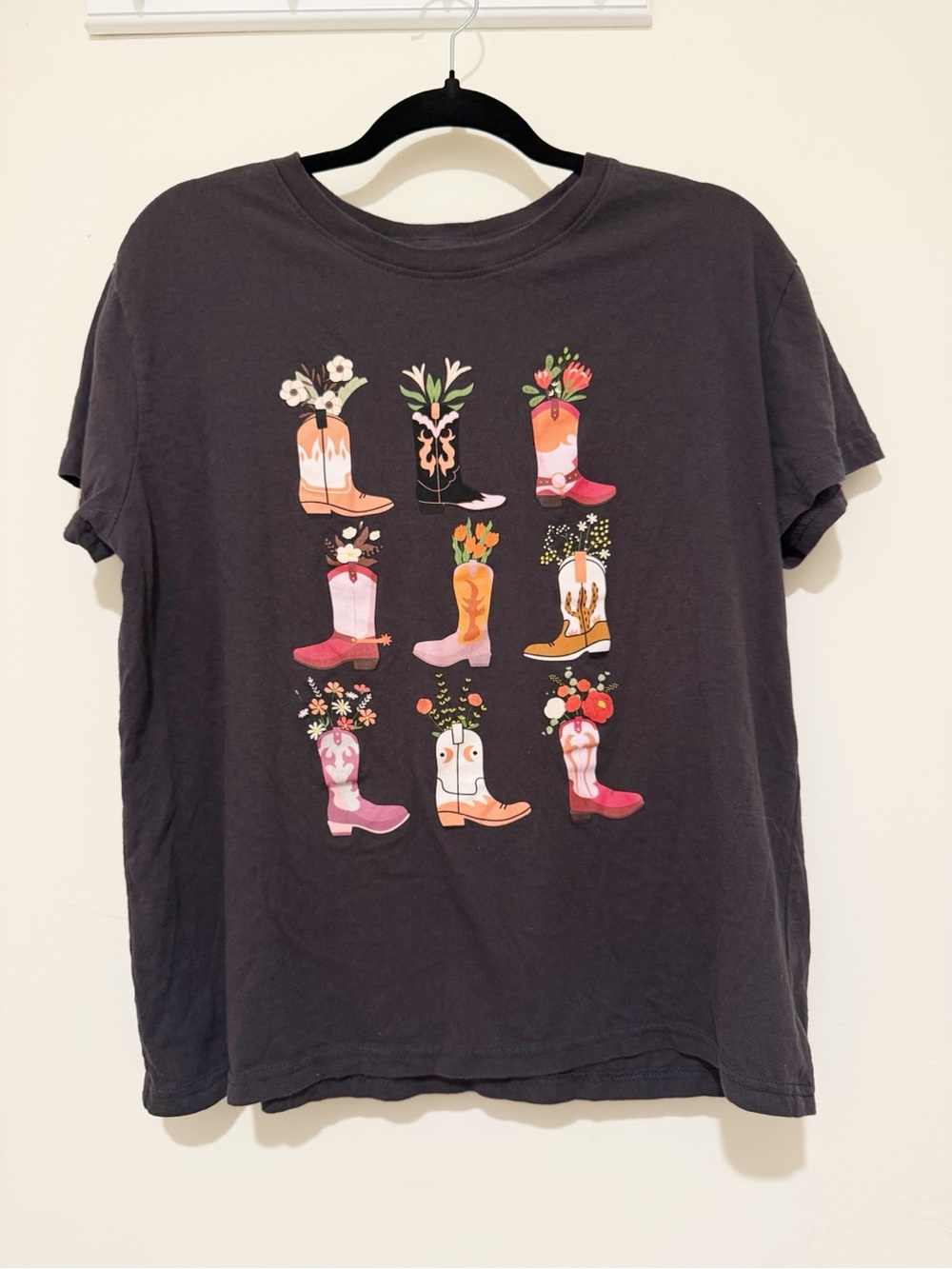 Womenβs Black Graphic Tee with Pink & Orange Boot Motif